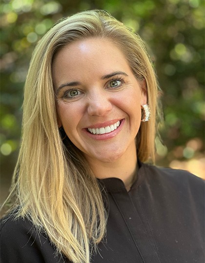 Young woman with flawless smile after porcelain veneers