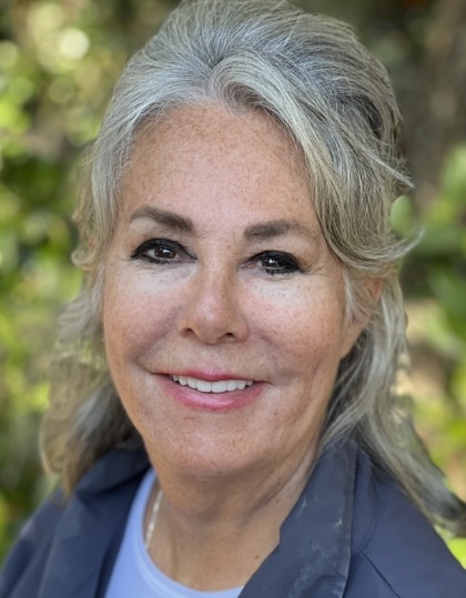 Woman with flawless smile after porecelain veneer treatment