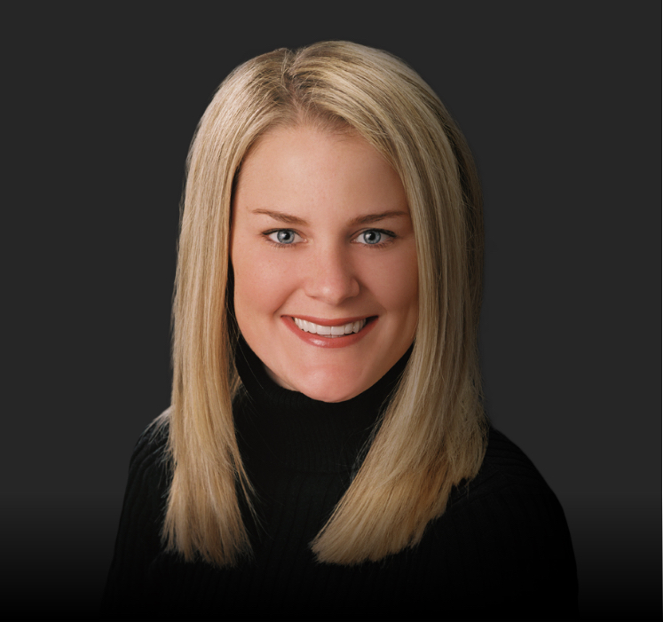 Dental patient Grace smiling after porcelain veneer treatment