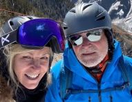 Man and woman skiing