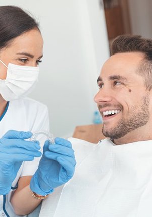 dentist discussing the cost of Invisalign in Mount Pleasant with a patient 