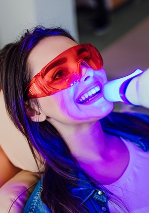 Patient receiving in office teeth whitening